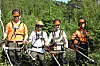 Her er de fire guttene som rydder skogen i Bjørndalen i sommer: Sander Leon Hansen Ulsund, Magnus Søndergaard Johnsen, Eduard Vasilenko og Benjamin Petersen. Med saga i hendene og guttastemning i laget sørger de for at framtidsskogen får vokse.