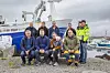 - Nå er det vår tur til å få skikkelig vei, mener Joar Hamlansø (bak fra venstre), Eskil Arnøy, Jan Arne Arnøy, Jostein Sørensen, Mattias Sørensen, Håkon Sørensen, Foran fra venster: Arnfinn Arnøy, Arne Jakob Arnøy, Gina Arnø med Marie på armen, Lars Eirik Nordheim,
