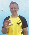 Det synlige bevis på medalje og tittel.